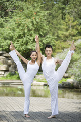 Young couple doing yoga