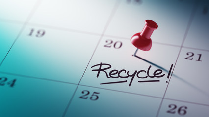 Concept image of a Calendar with a red push pin. Closeup shot of