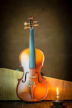 violin with lantern on old steel background,still life