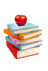 Reading Is Fundamental/ Uneven stack of blank covered books with red apple on top.  Isolated on white
