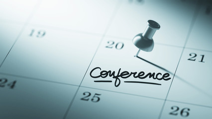Concept image of a Calendar with a push pin. Closeup shot of a t