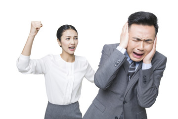 Young businesswoman scolding businessman