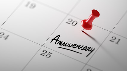 Concept image of a Calendar with a red push pin. Closeup shot of