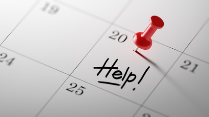 Concept image of a Calendar with a red push pin. Closeup shot of