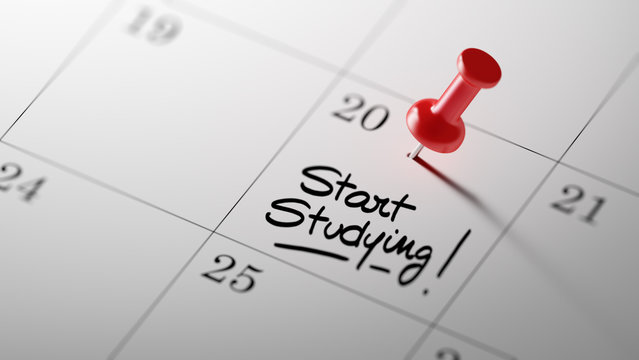 Concept image of a Calendar with a red push pin. Closeup shot of