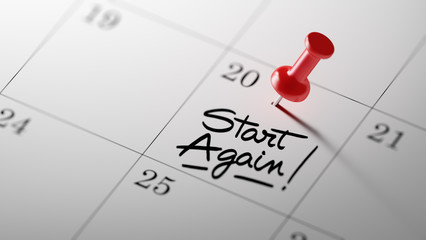 Concept image of a Calendar with a red push pin. Closeup shot of