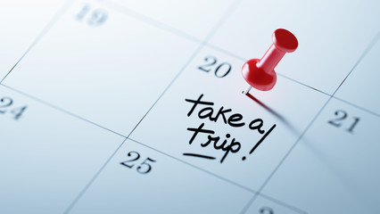 Concept image of a Calendar with a red push pin. Closeup shot of