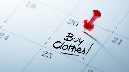 Concept image of a Calendar with a red push pin. Closeup shot of