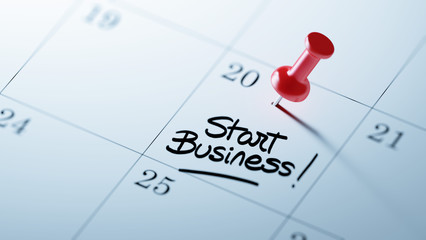 Concept image of a Calendar with a red push pin. Closeup shot of