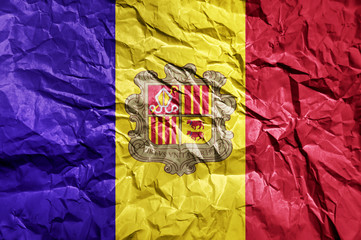Andorra flag painted on crumpled paper background