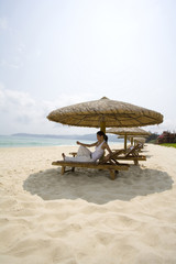 Young woman relaxing on the beach