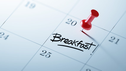 Concept image of a Calendar with a red push pin. Closeup shot of