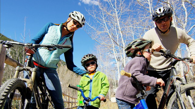 Caucasian family bicycle children boys healthy outdoor lifestyle fitness travel