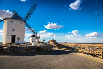 Famous windmills in Consuegra at sunset, province of Toledo, Cas - obrazy, fototapety, plakaty