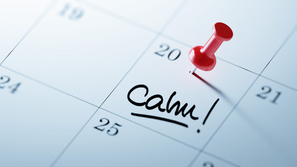 Concept image of a Calendar with a red push pin. Closeup shot of