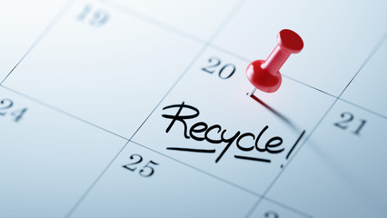 Concept image of a Calendar with a red push pin. Closeup shot of