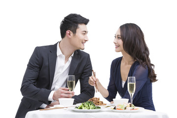 Happy young couple having dinner