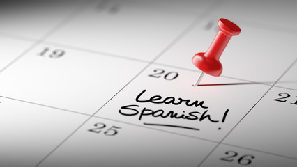 Concept image of a Calendar with a red push pin. Closeup shot of