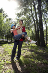 Man Carrying His Girlfriend Through The Park