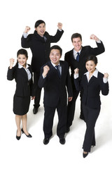 Fototapeta premium Excited business professionals on cutout background