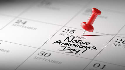 Concept image of a Calendar with a red push pin. Closeup shot of