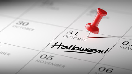 Fototapeta premium Concept image of a Calendar with a red push pin. Closeup shot of