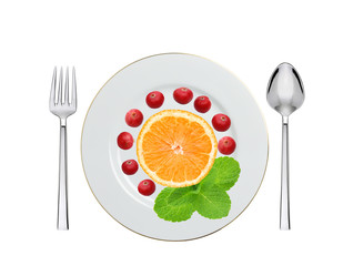 plate with cranberry, orange and mint herb, spoon and fork isola