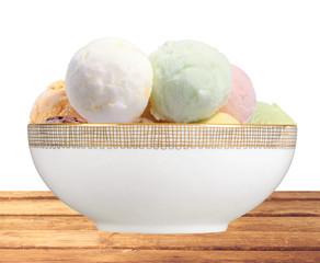 Scoop of fruit ice cream in plate on table isolated on white bac