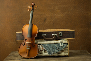 Vintage violin and case with old steel background