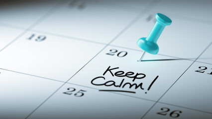 Concept image of a Calendar with a blue push pin. Closeup shot o