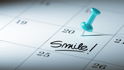 Fototapeta premium Concept image of a Calendar with a blue push pin. Closeup shot o