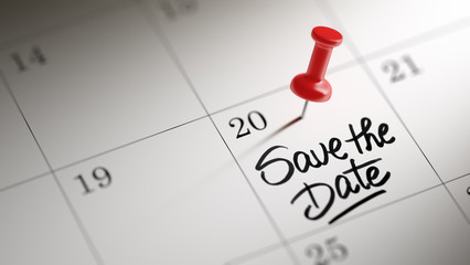 Concept image of a Calendar with a red push pin. Closeup shot of