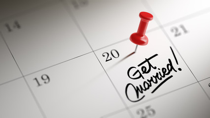 Concept image of a Calendar with a red push pin. Closeup shot of