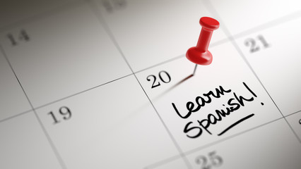 Concept image of a Calendar with a red push pin. Closeup shot of