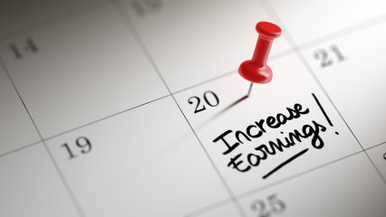 Concept image of a Calendar with a red push pin. Closeup shot of