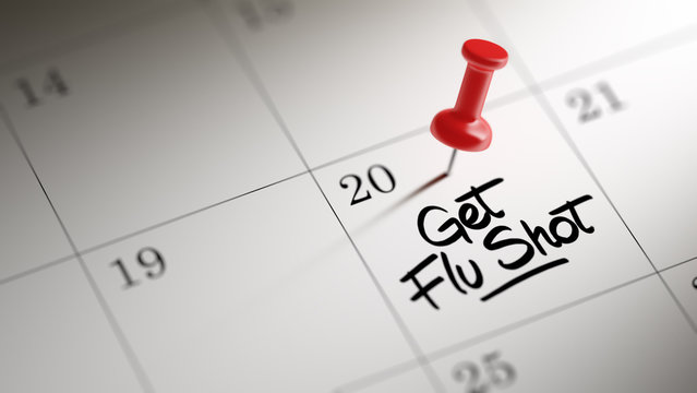 Concept image of a Calendar with a red push pin. Closeup shot of