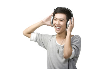 Fototapeta premium Young man with headphones listening to music