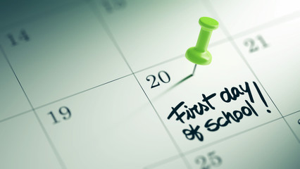 Concept image of a Calendar with a green push pin. Closeup shot