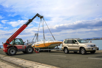 Crane lifts a boat