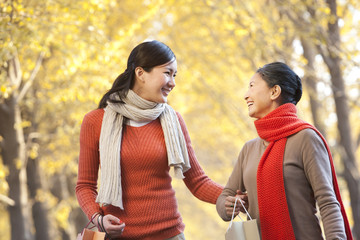 Mother with adult daughter shopping in Autumn