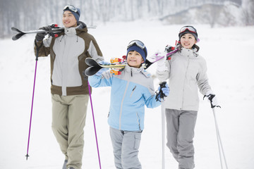 Young family skiing in ski resort