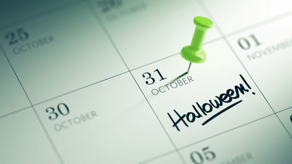 Fototapeta premium Concept image of a Calendar with a green push pin. Closeup shot