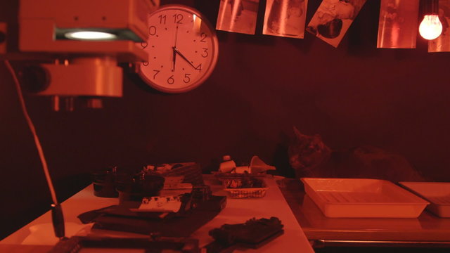 Photography darkroom with red lighting full of magic 