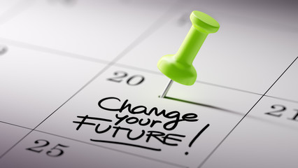 Concept image of a Calendar with a green push pin. Closeup shot