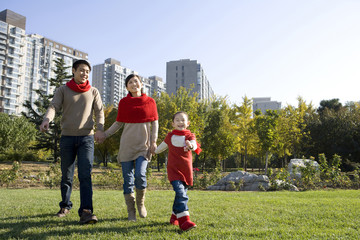 Young Family Enjoying a Park in Autumn