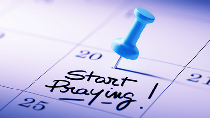 Concept image of a Calendar with a blue push pin. Closeup shot o