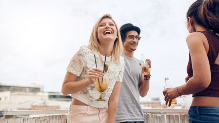 Young woman enjoying party with her friends