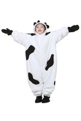 Cute girl in a cow costume playing