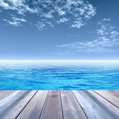 Conceptual wood deck over sea and sky