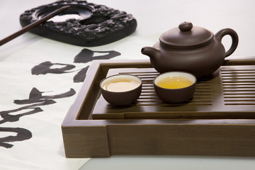 Obraz na płótnie Canvas Tea set and Chinese calligraphy